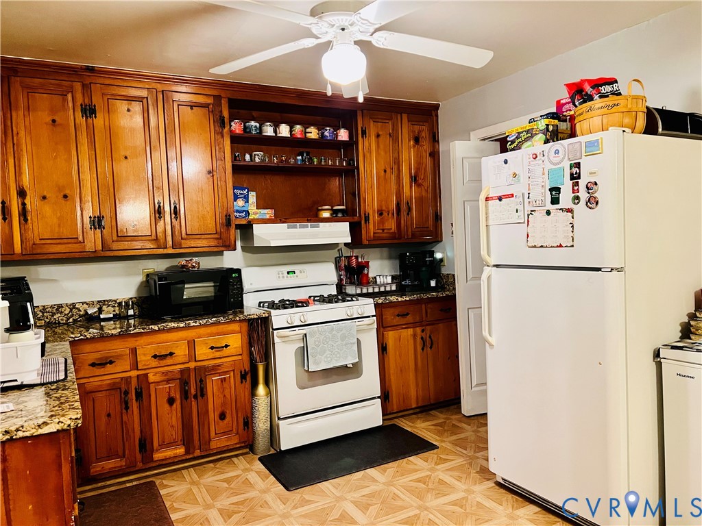 2305 Apollo Road Richmond, VA 23223 - Photo 4 of 16 Kitchen with white appliances, granite countertops