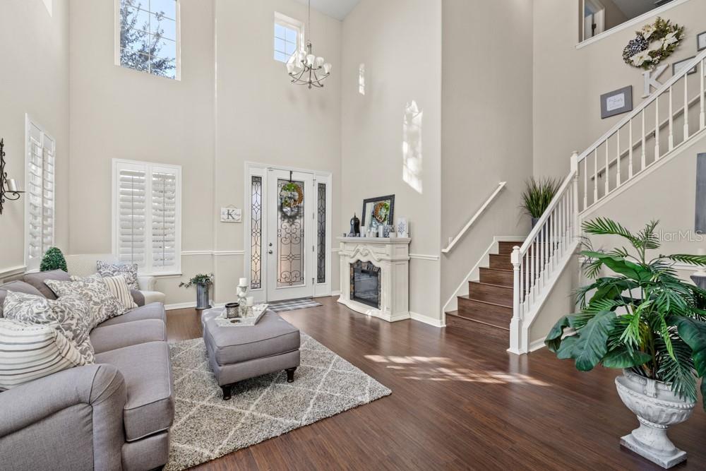706 Fringe Tree Court Deland, FL 32724 - Photo 25 of 70 a living room with furniture and a potted plant