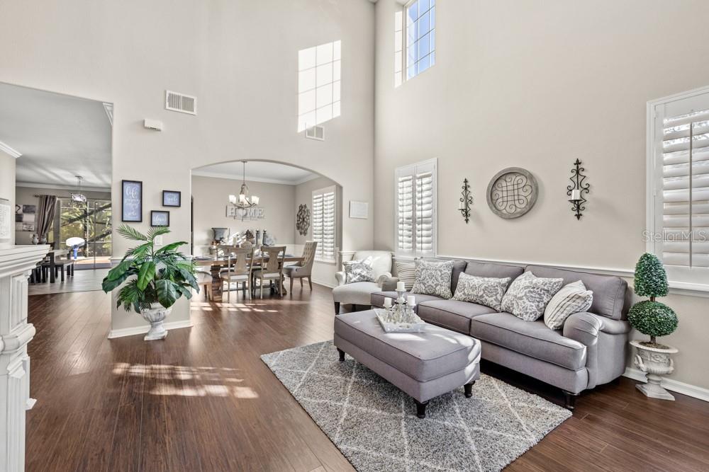 706 Fringe Tree Court Deland, FL 32724 - Photo 26 of 70 a living room with furniture and wooden floor