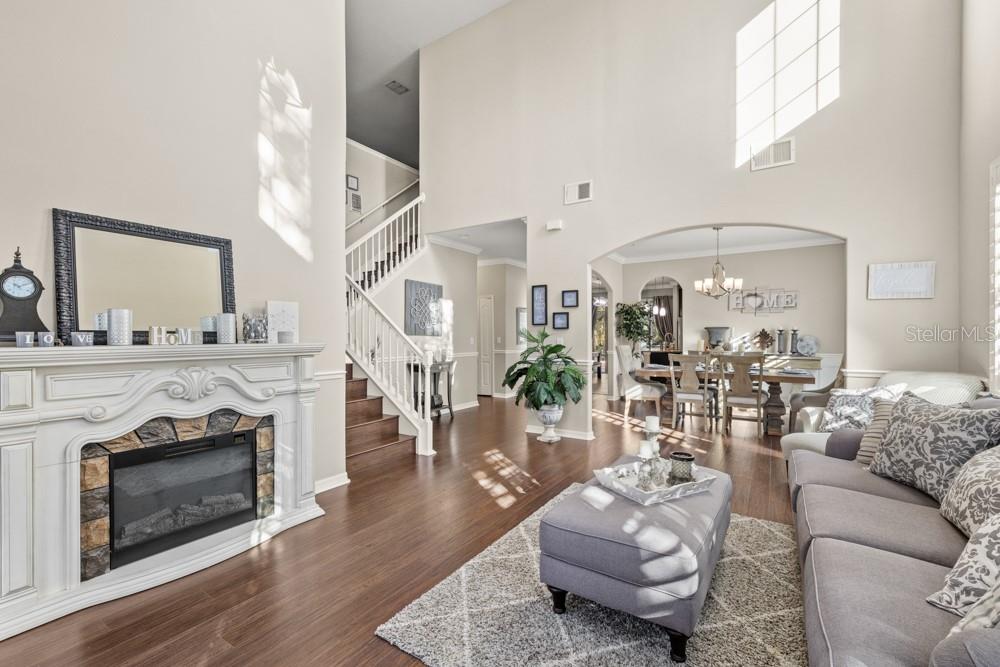 706 Fringe Tree Court Deland, FL 32724 - Photo 27 of 70 a living room with furniture and a fireplace