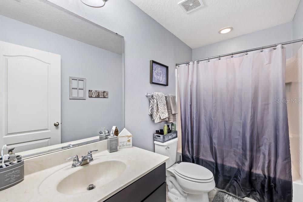 706 Fringe Tree Court Deland, FL 32724 - Photo 28 of 70 a bathroom with a sink toilet and shower