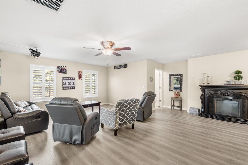 706 Fringe Tree Court Deland, FL 32724 - Photo 34 of 70 a living room with furniture and a wooden floor