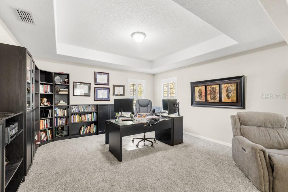 706 Fringe Tree Court Deland, FL 32724 - Photo 47 of 70 a view of a livingroom with workspace and a couch