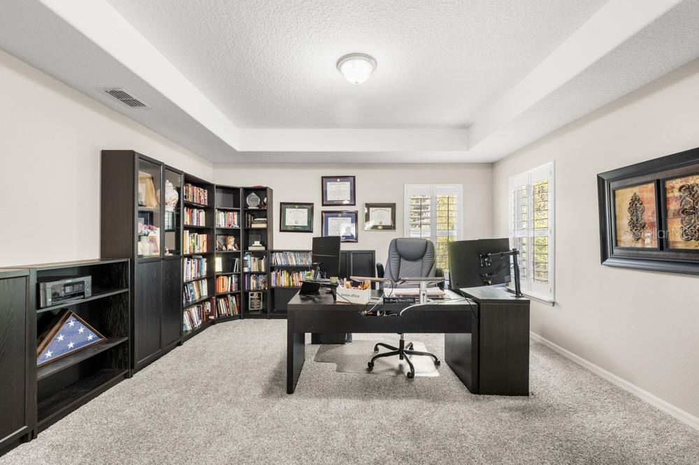 706 Fringe Tree Court Deland, FL 32724 - Photo 48 of 70 a view of a livingroom with workspace and a window