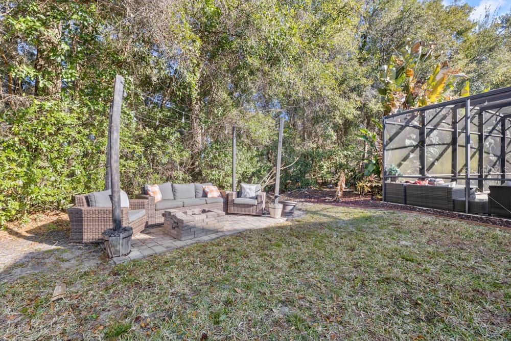 706 Fringe Tree Court Deland, FL 32724 - Photo 57 of 70 a view of a house with backyard porch and sitting area