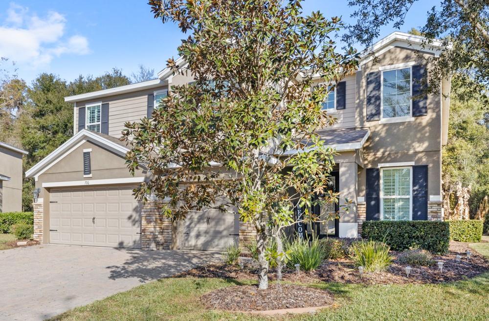 706 Fringe Tree Court Deland, FL 32724 - Photo 59 of 70 front view of a house with a yard