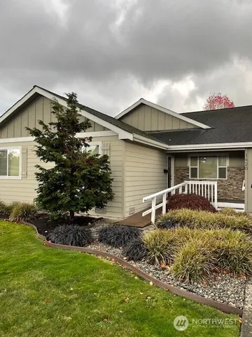 a front view of a house with garden