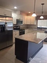 a view of a room with a fireplace