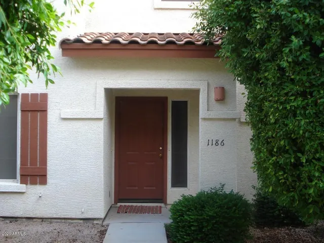 a front view of a house with yard and garage