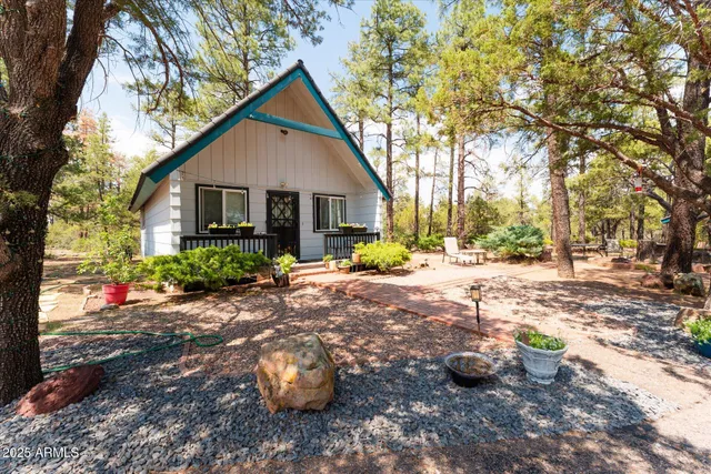 a view of a house with a yard covered in snow