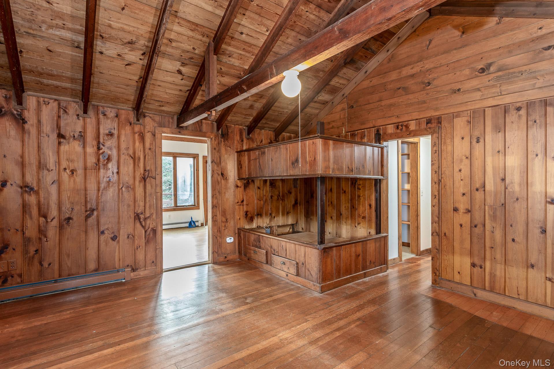 62 Birch Hill Road Mount Sinai, NY 11766 - Photo 5 of 36 a view of a room with wooden walls