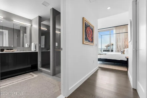 a view of a bathroom with dual sinks