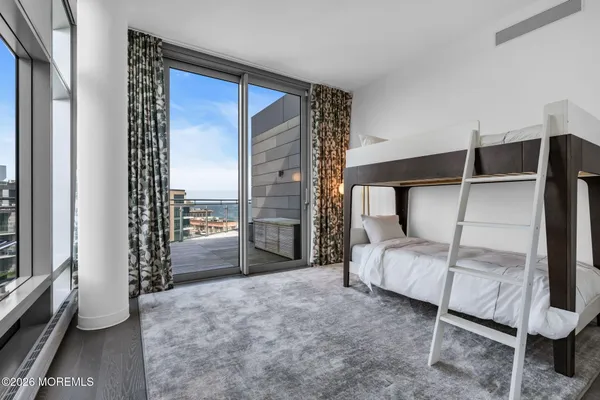 a bedroom with a bed and a cabinets