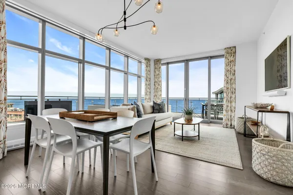 a view of a dining room with furniture window and outside view
