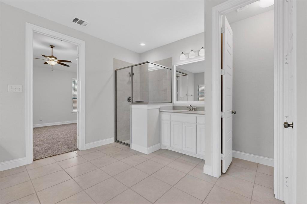 805 Rustic Trail Midlothian, TX 76065 - Photo 23 of 40 a bathroom with a shower and a sink