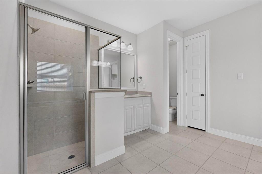 805 Rustic Trail Midlothian, TX 76065 - Photo 24 of 40 a bathroom with a shower and a sink