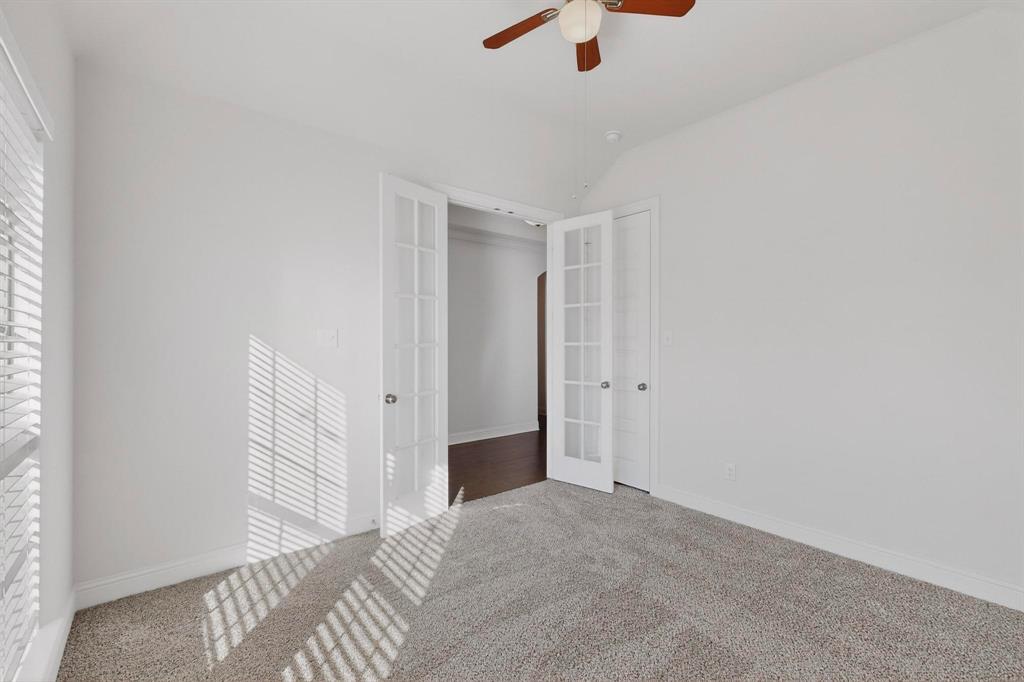805 Rustic Trail Midlothian, TX 76065 - Photo 27 of 40 a view of a livingroom with a ceiling fan and window