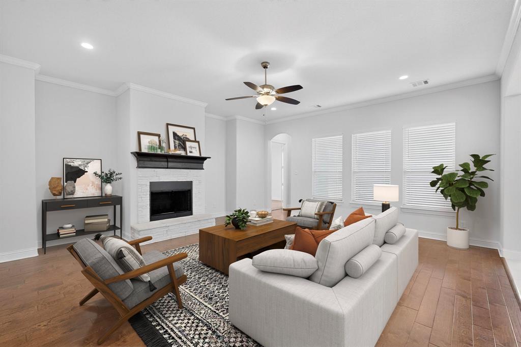 805 Rustic Trail Midlothian, TX 76065 - Photo 3 of 40 a living room with furniture fireplace and a potted plant