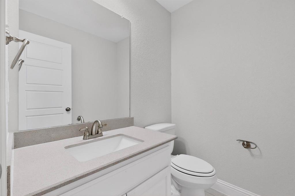 805 Rustic Trail Midlothian, TX 76065 - Photo 35 of 40 a bathroom with a sink toilet and a mirror