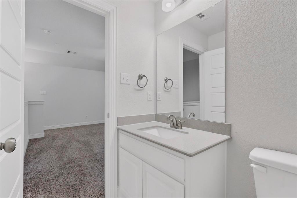 805 Rustic Trail Midlothian, TX 76065 - Photo 36 of 40 a bathroom with a sink and a toilet