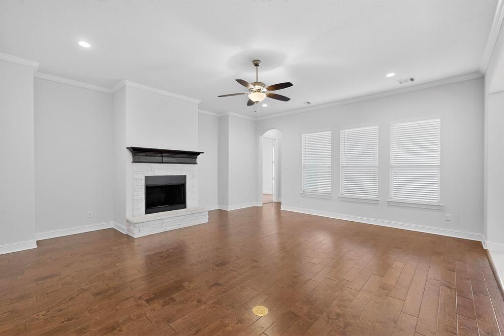 805 Rustic Trail Midlothian, TX 76065 - Photo 4 of 40 a view of an empty room with a fireplace and a window