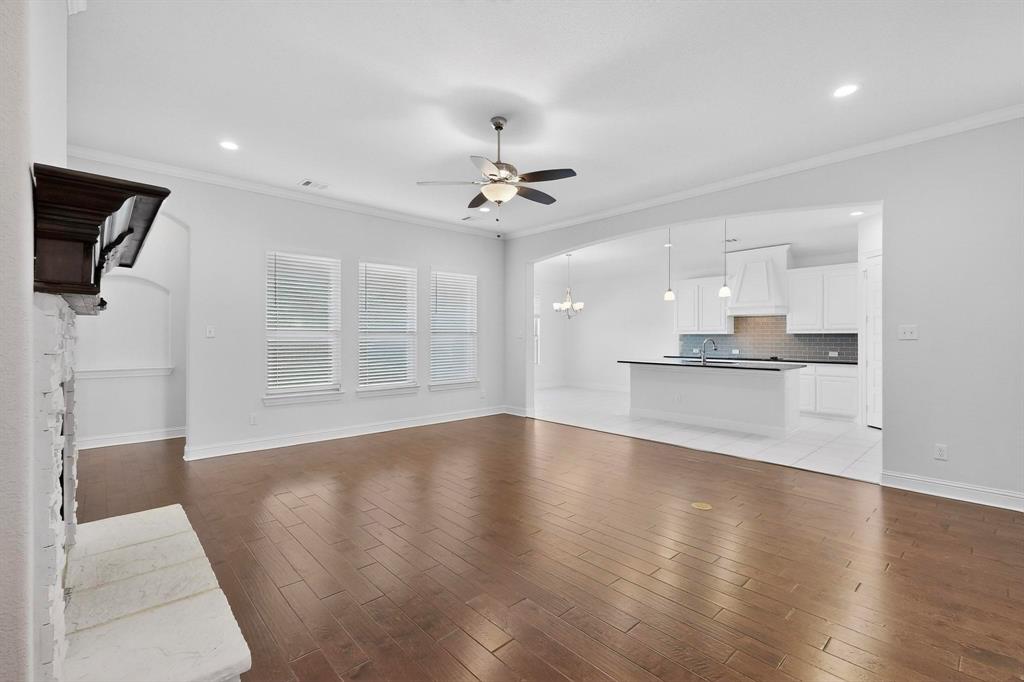 805 Rustic Trail Midlothian, TX 76065 - Photo 6 of 40 a view of empty room with wooden floor and ceiling fan