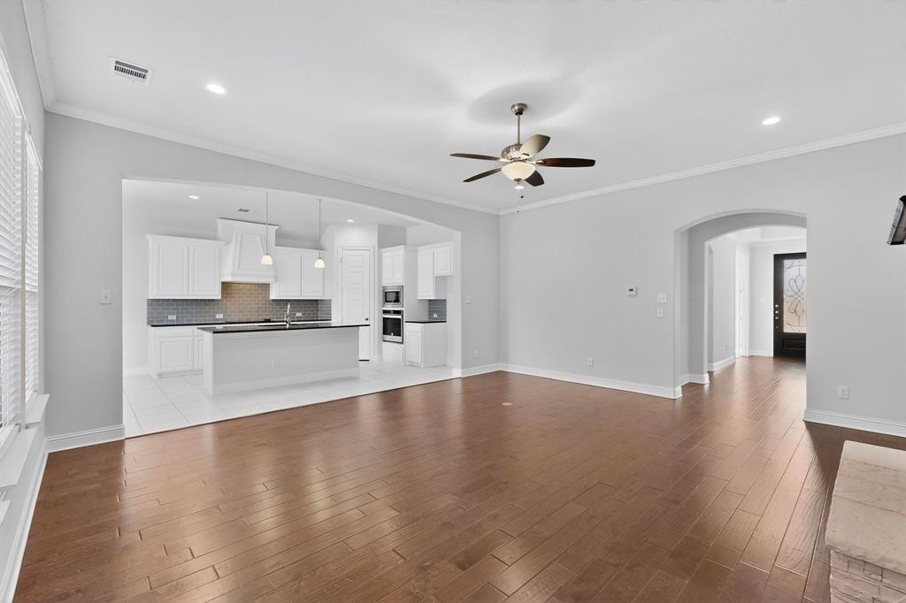 805 Rustic Trail Midlothian, TX 76065 - Photo 7 of 40 a view of a kitchen with a sink and a stove top oven