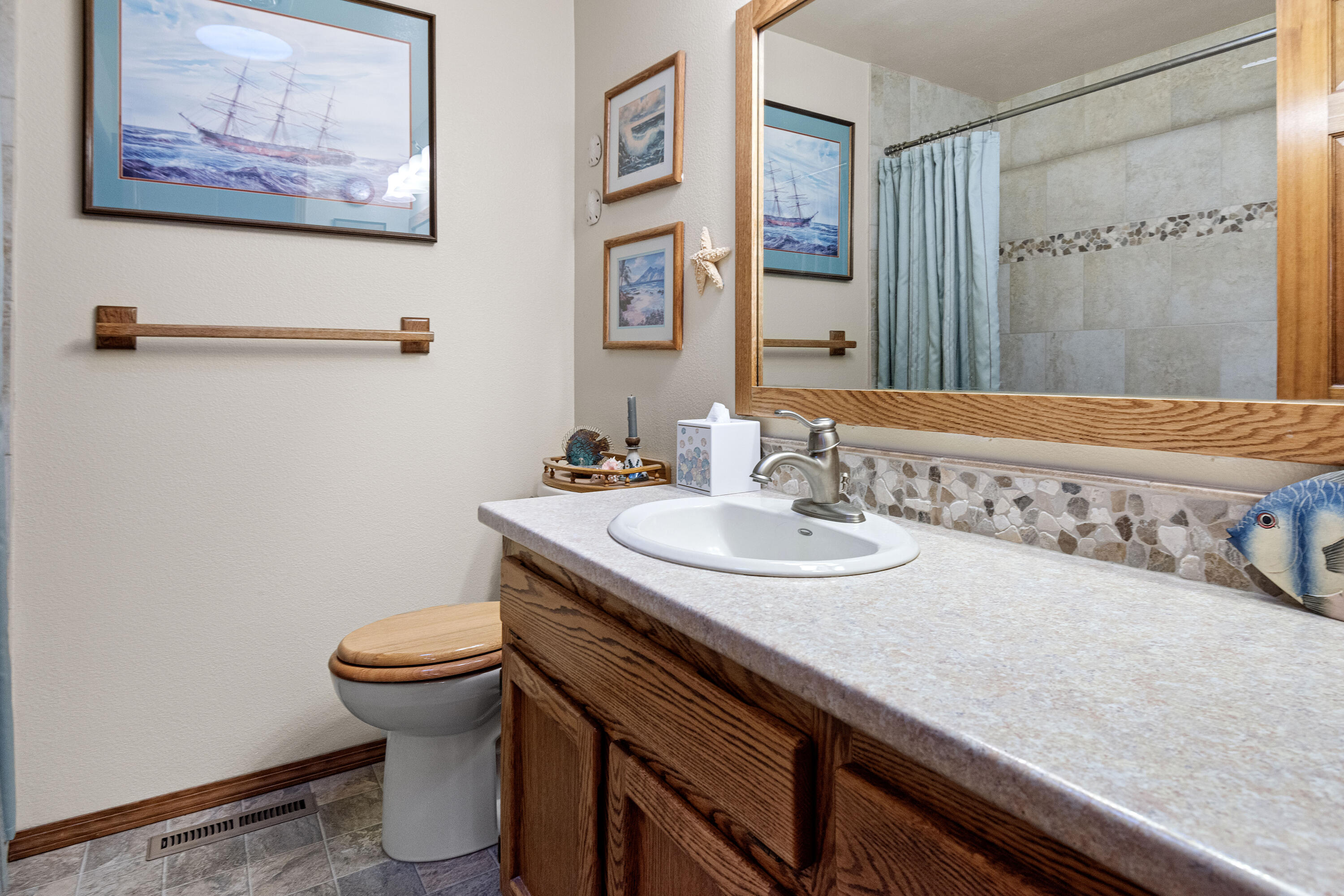 22252 Nelson Road Bend, OR 97701 - Photo 10 of 21 a bathroom with a granite countertop sink and a mirror