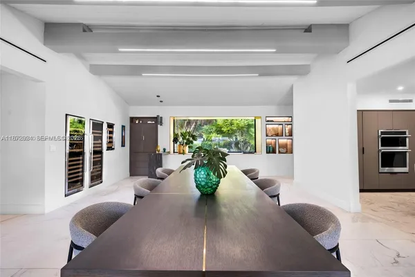 a kitchen with a table and chairs in it