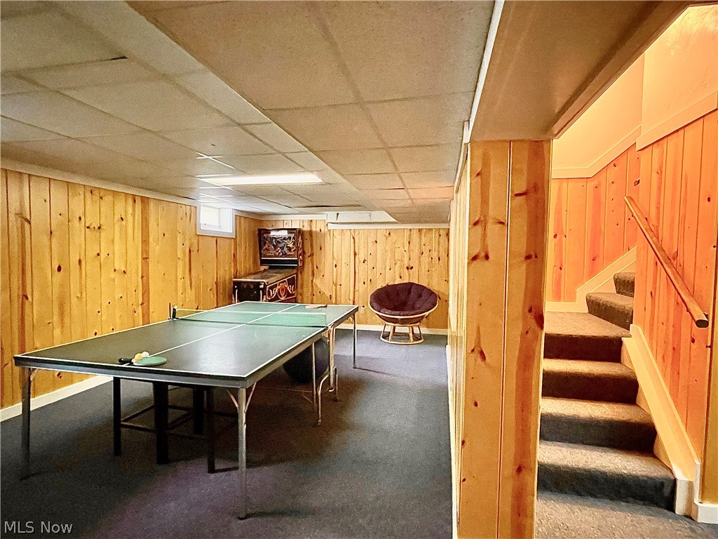 2549 Sourek Road Akron, OH 44333 - Photo 24 of 28 Now, Down to the lower level and the finished recreation rooms with different areas... enough room for a Ping Pong table, Pool Table and so much more! And if you think that this takes away from storage. No Way! This home has a large storage hidden from view.