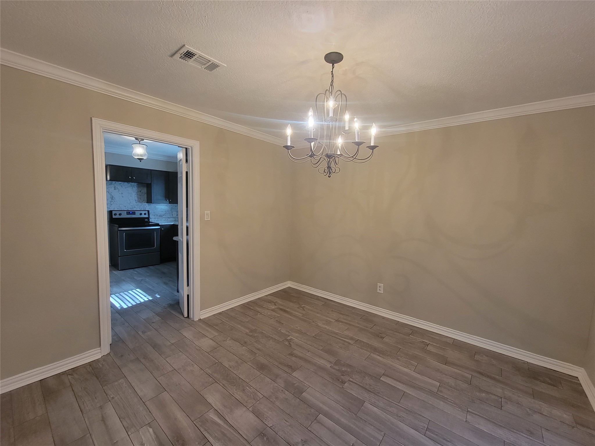 4015 Chapel Square Drive Spring, TX 77388 - Photo 8 of 27 This elegant secondary dining room features a charming chandelier, adding a touch of sophistication.