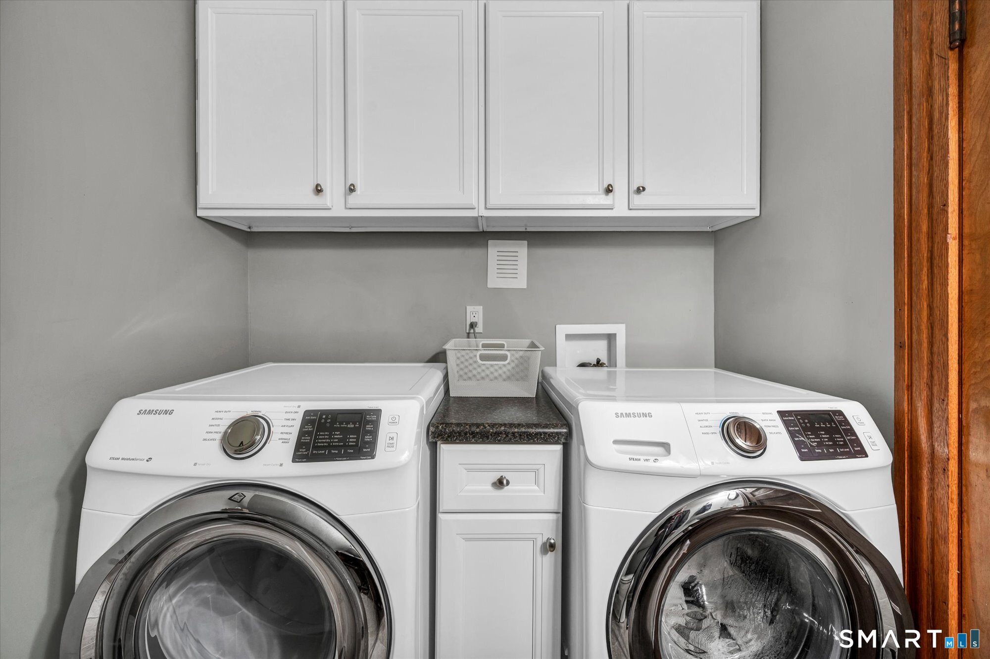52 Stuart Street Newington, CT 06111 - Photo 33 of 33 Washer and dryer on first floor with amble cabinet space!