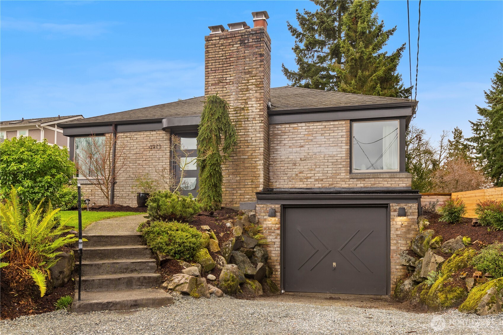 a front view of a house with garden