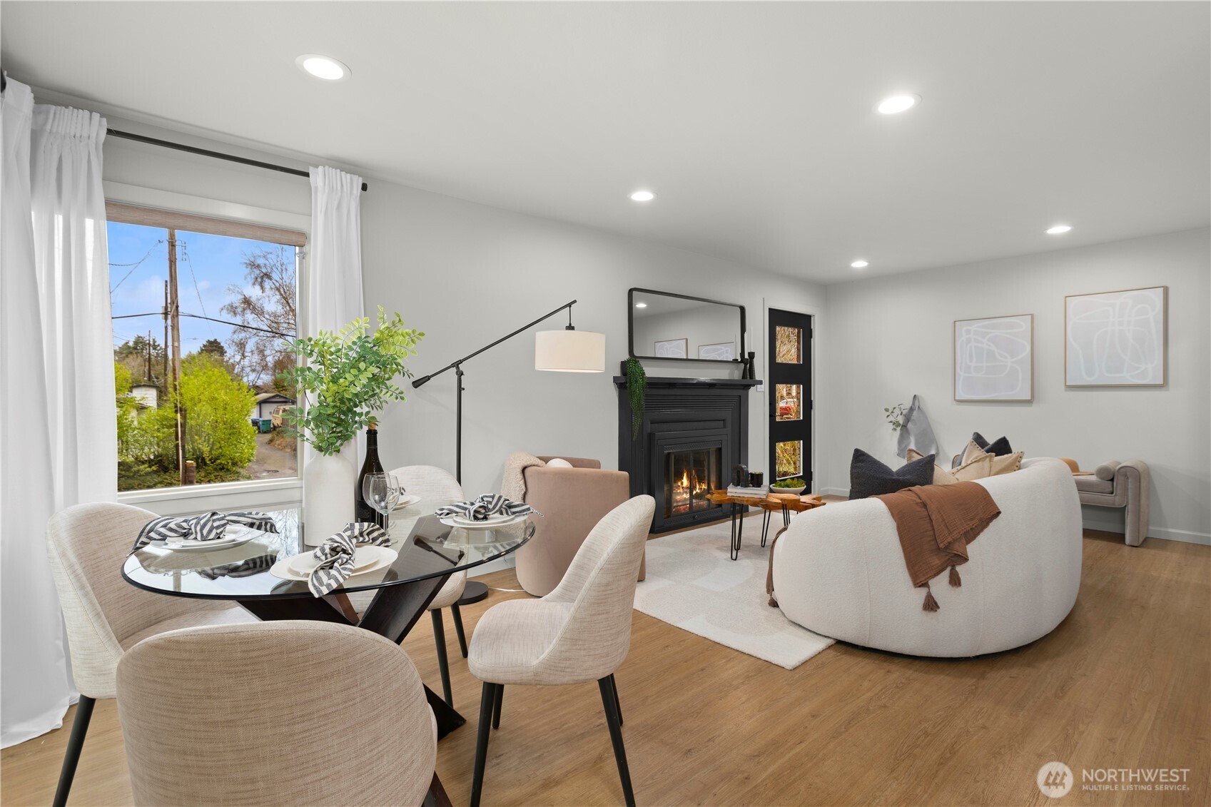 3911 Southwest Forest Street Seattle, WA 98116 - Photo 11 of 40 a living room with fireplace furniture and a flat screen tv