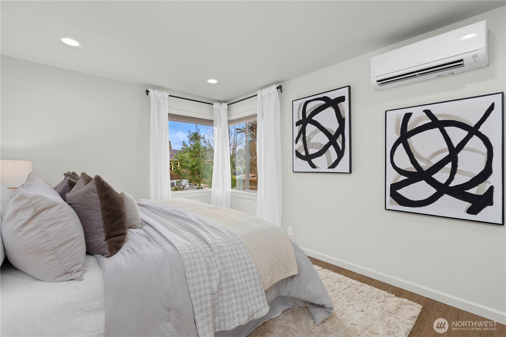 3911 Southwest Forest Street Seattle, WA 98116 - Photo 15 of 40 a bedroom with a bed and window