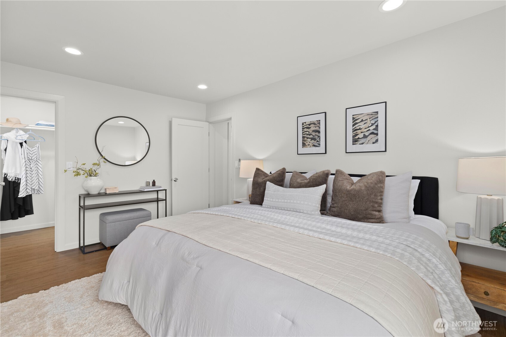 3911 Southwest Forest Street Seattle, WA 98116 - Photo 17 of 40 a bedroom with a bed and a chandelier