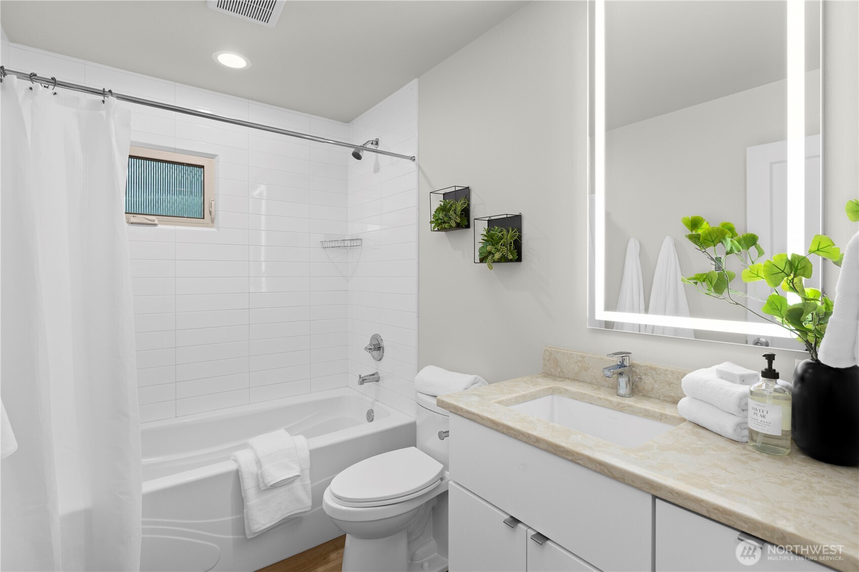 3911 Southwest Forest Street Seattle, WA 98116 - Photo 20 of 40 a bathroom with a granite countertop sink a toilet and shower
