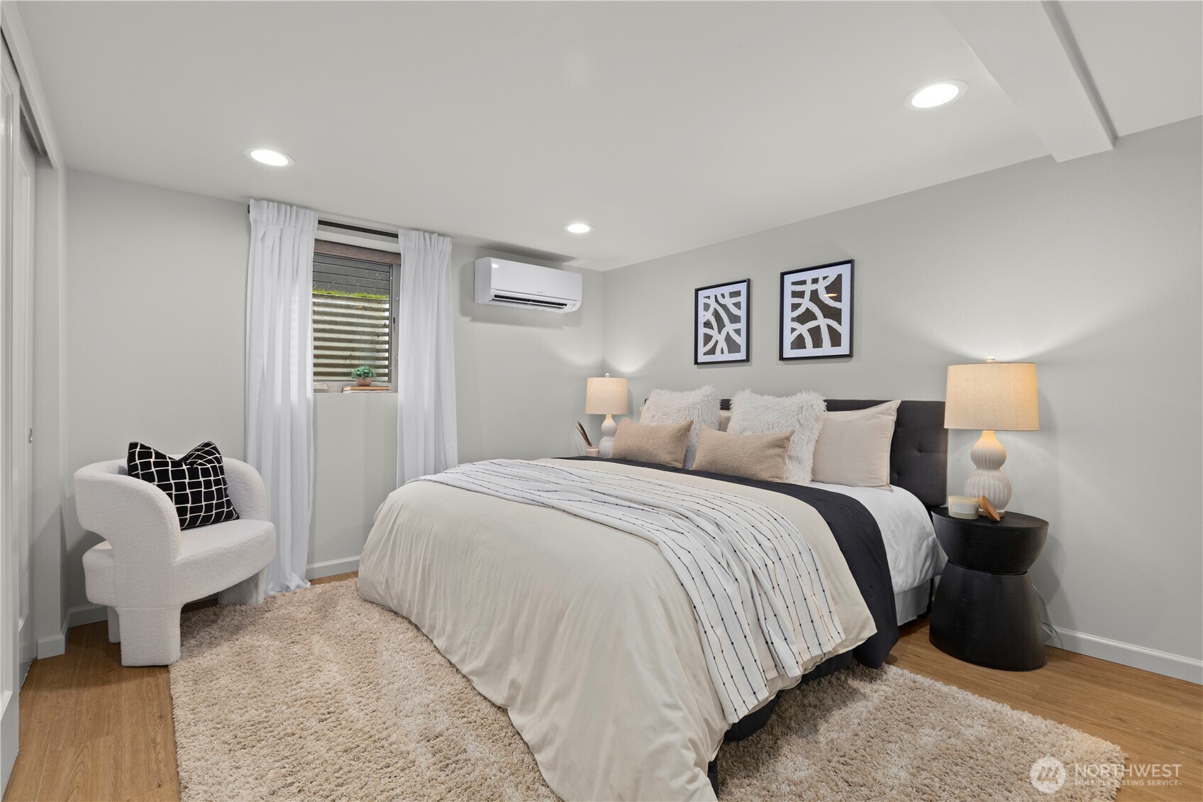 3911 Southwest Forest Street Seattle, WA 98116 - Photo 23 of 40 a spacious bedroom with a bed and couch