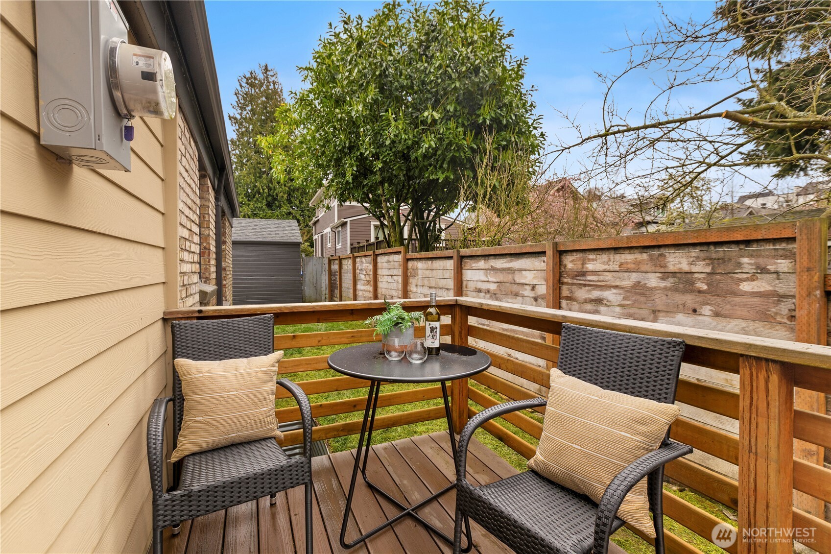 3911 Southwest Forest Street Seattle, WA 98116 - Photo 32 of 40 a view of a chairs and table on the balcony