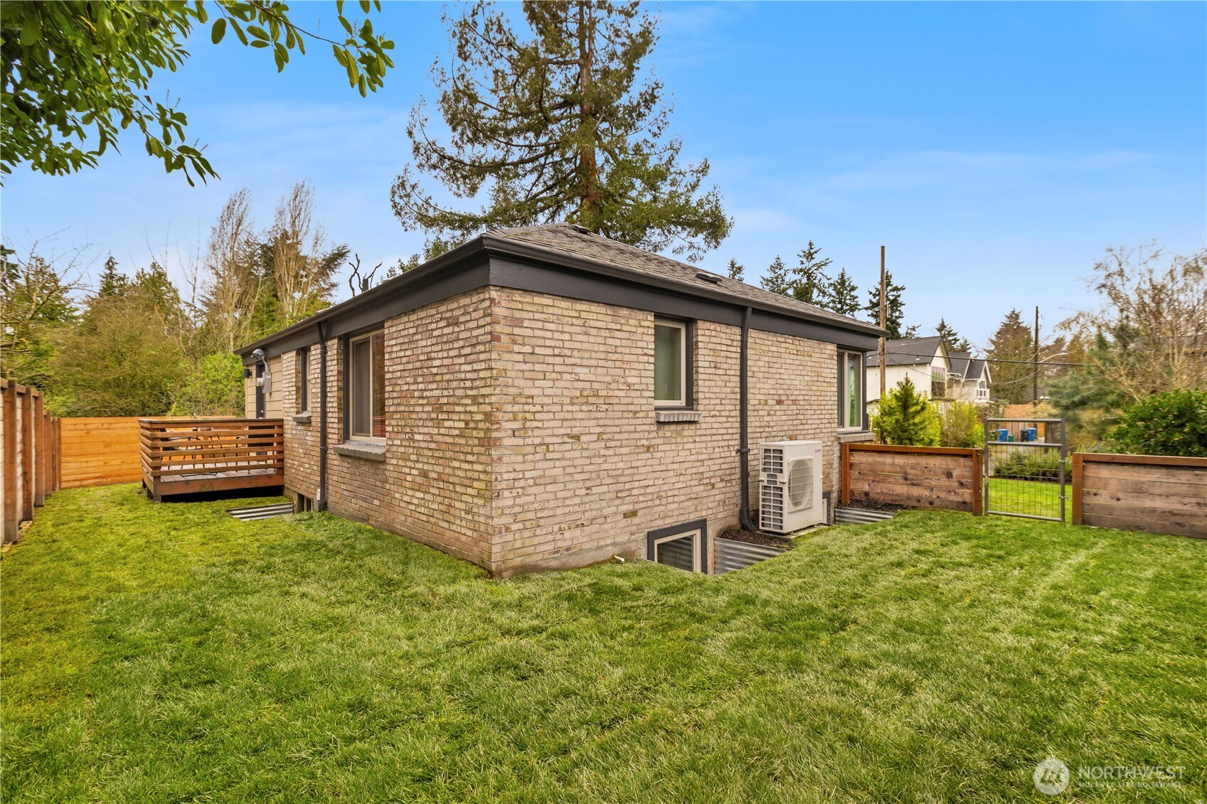 3911 Southwest Forest Street Seattle, WA 98116 - Photo 34 of 40 a view of a house with a yard