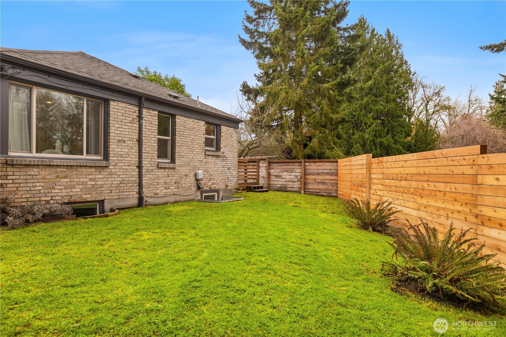 3911 Southwest Forest Street Seattle, WA 98116 - Photo 37 of 40 a view of a backyard with a garden