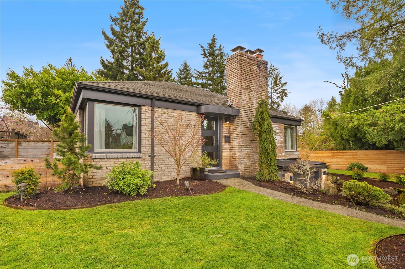 3911 Southwest Forest Street Seattle, WA 98116 - Photo 4 of 40 a front view of a house with garden