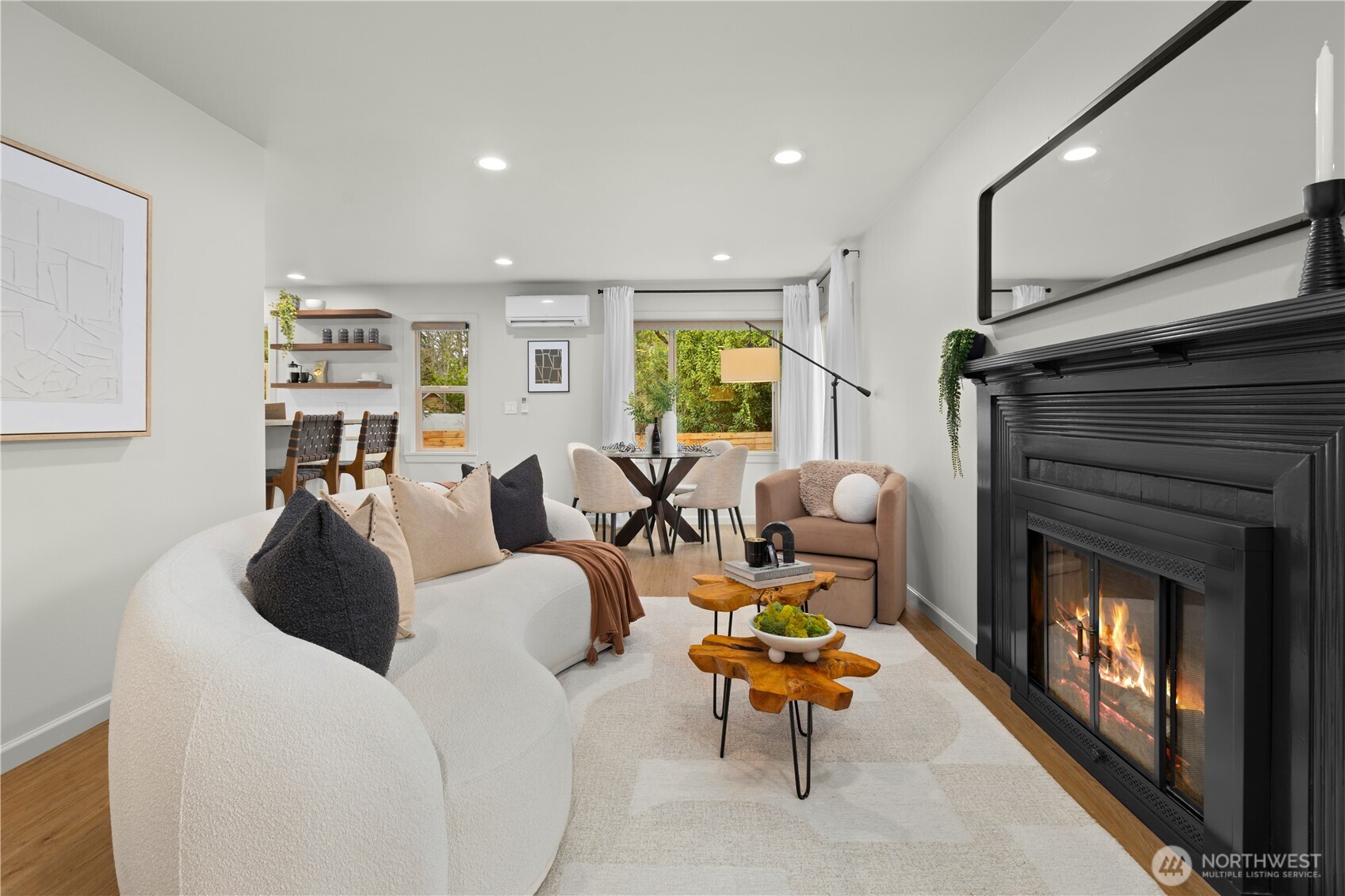 3911 Southwest Forest Street Seattle, WA 98116 - Photo 8 of 40 a living room with furniture and a fireplace