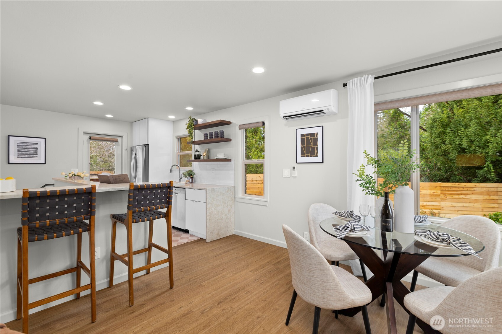 3911 Southwest Forest Street Seattle, WA 98116 - Photo 9 of 40 a view of a dining room with furniture and wooden floor