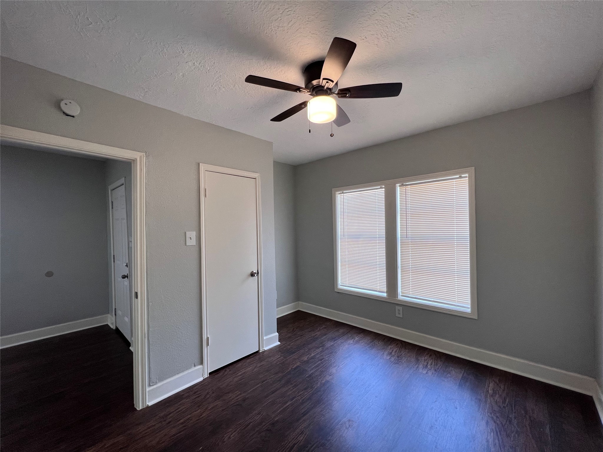 2412 Stuart Street Houston, TX 77004 - Photo 11 of 32 a view of empty room with wooden floor and fan