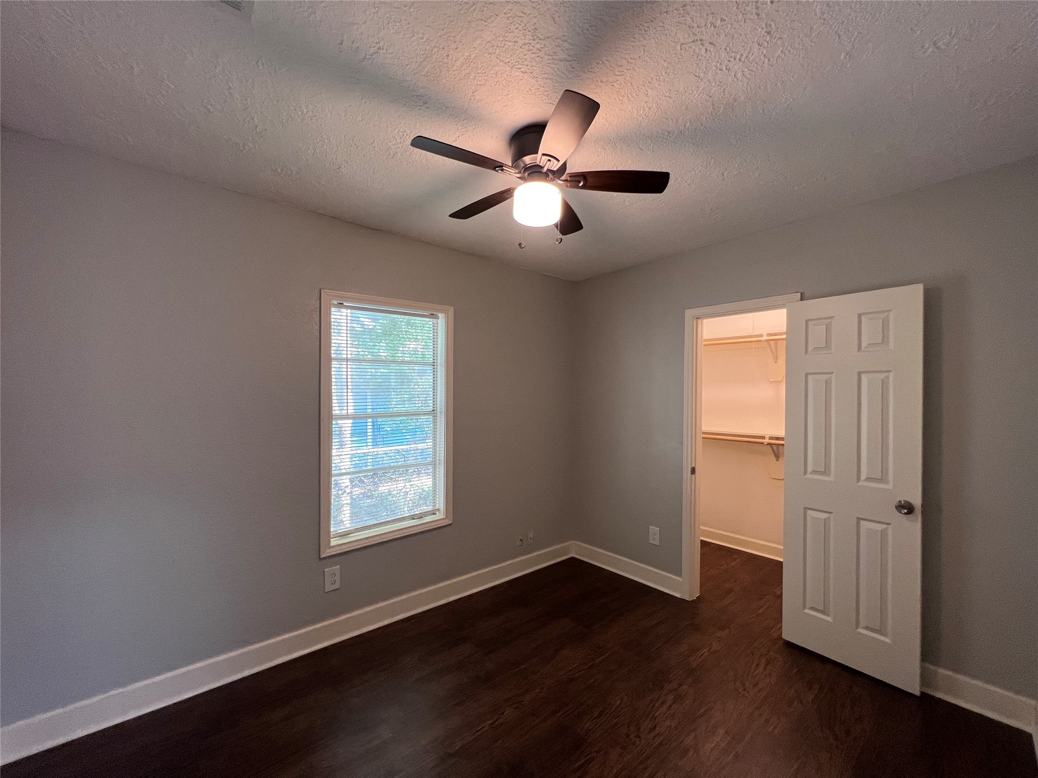2412 Stuart Street Houston, TX 77004 - Photo 12 of 32 a view of empty room with wooden floor and fan