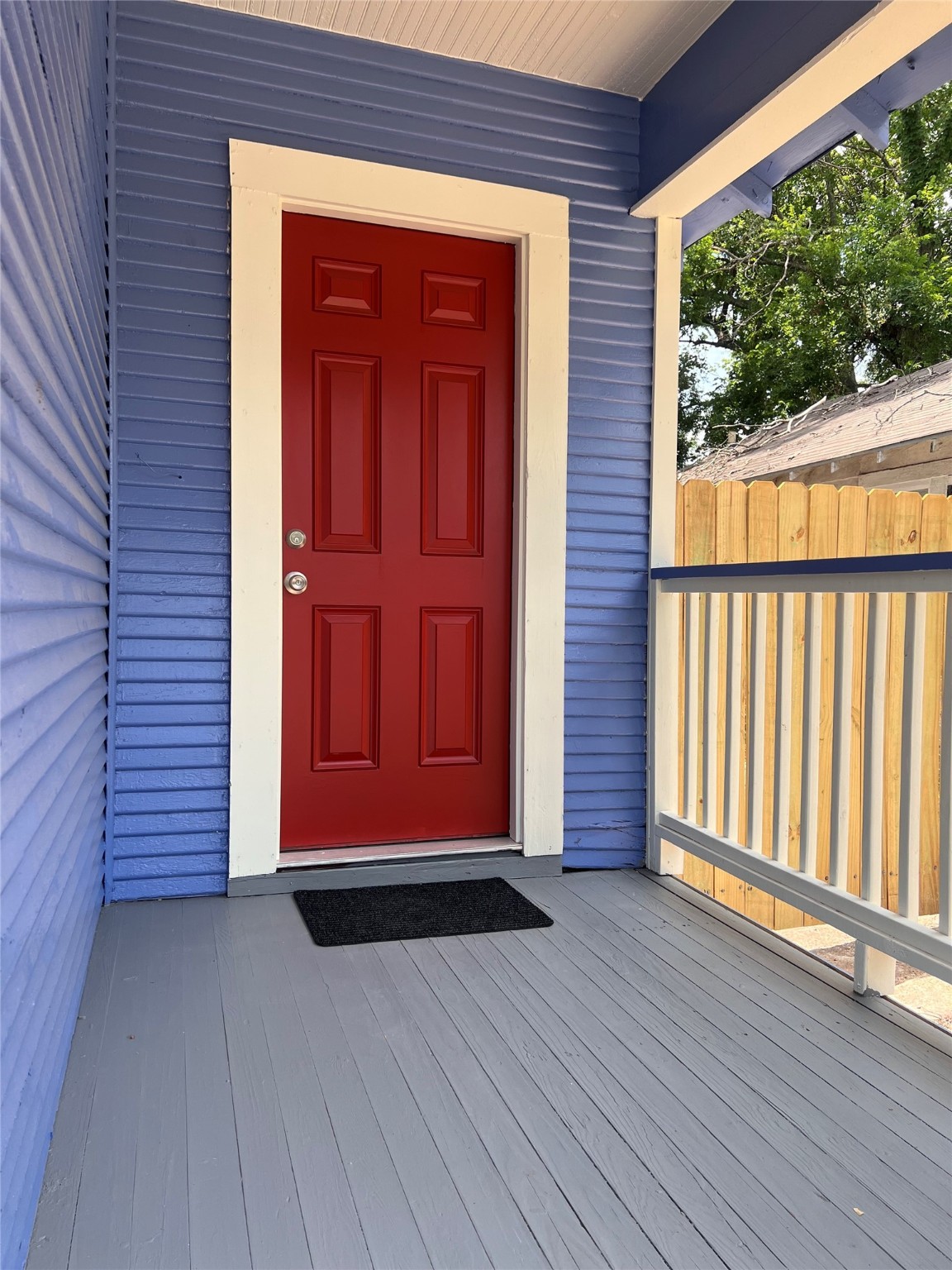 2412 Stuart Street Houston, TX 77004 - Photo 2 of 32 an entrance view of wooden balcony