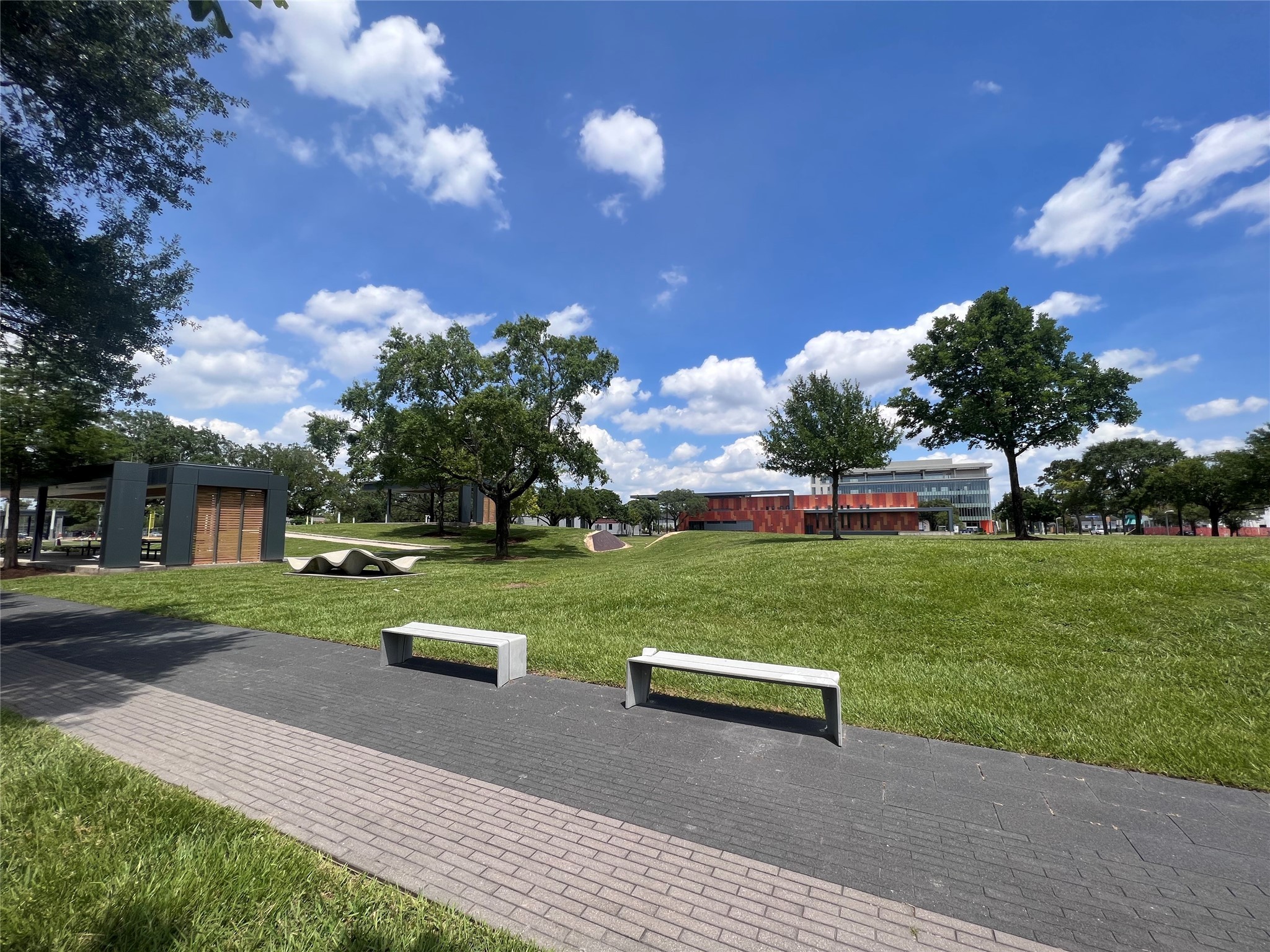2412 Stuart Street Houston, TX 77004 - Photo 29 of 32 a view of a park with large trees and a wooden fence