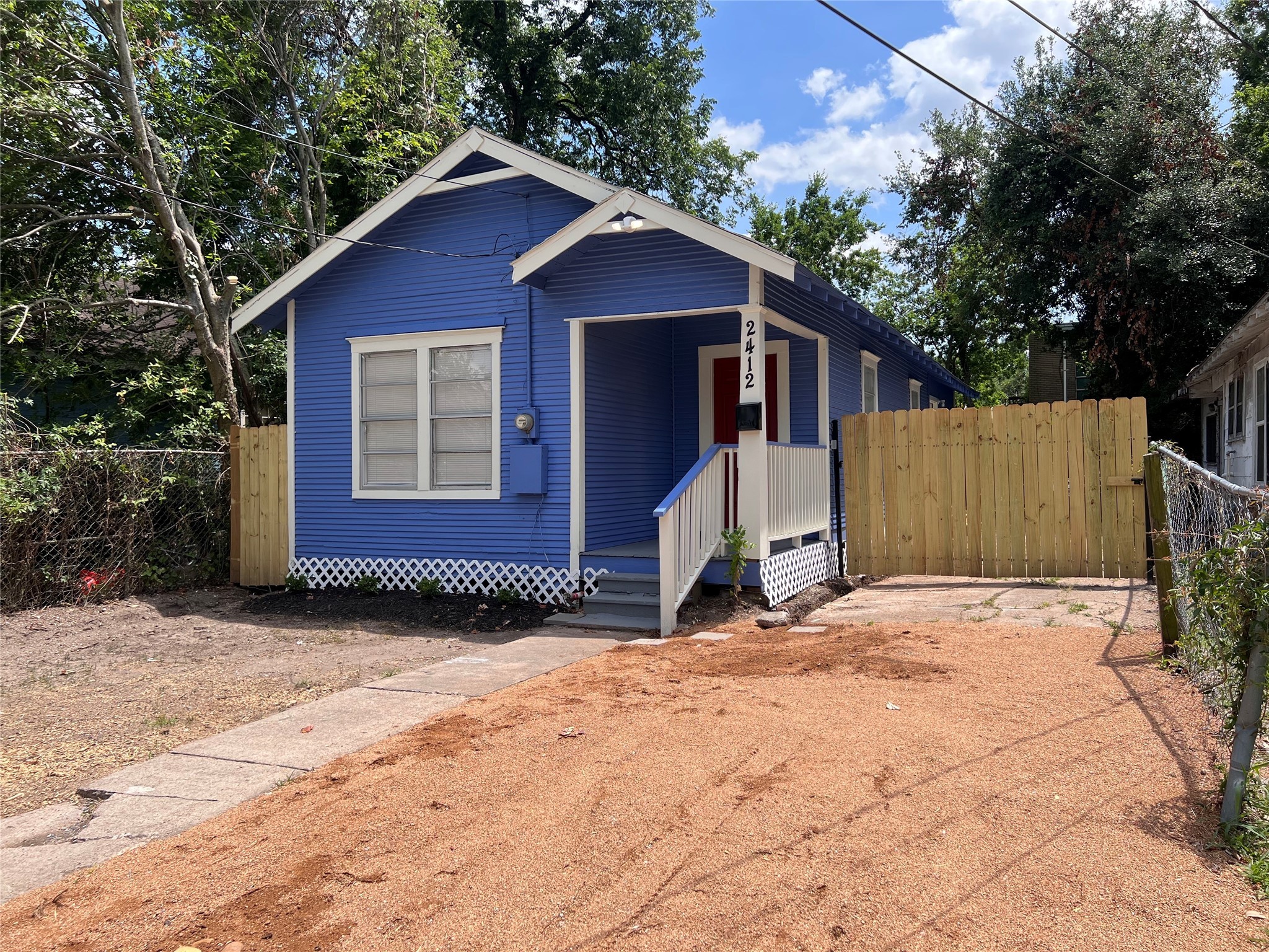 2412 Stuart Street Houston, TX 77004 - Photo 3 of 32 a view of a house with a yard and garage