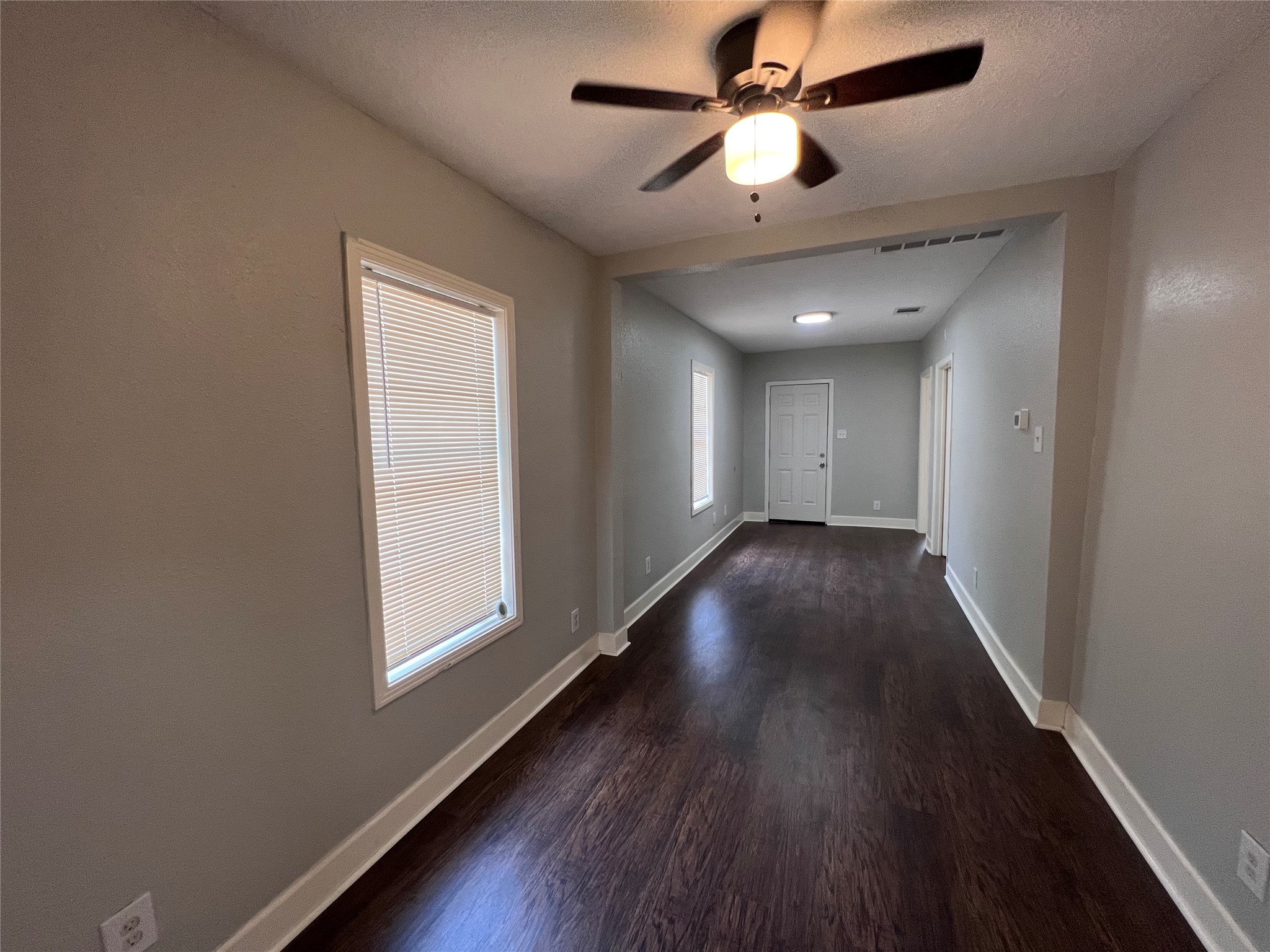2412 Stuart Street Houston, TX 77004 - Photo 5 of 32 wooden floor in an empty room with a window